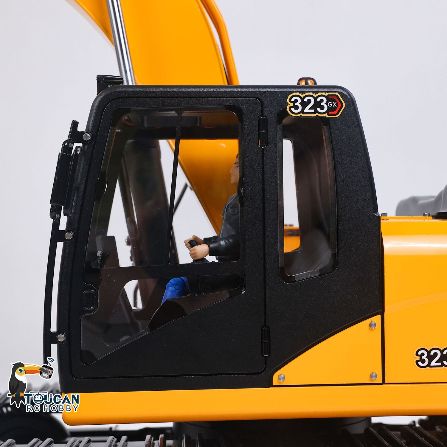 TOUCAN 323GX 1/12 RC hydraulic excavator cab detail with realistic operator cabin design