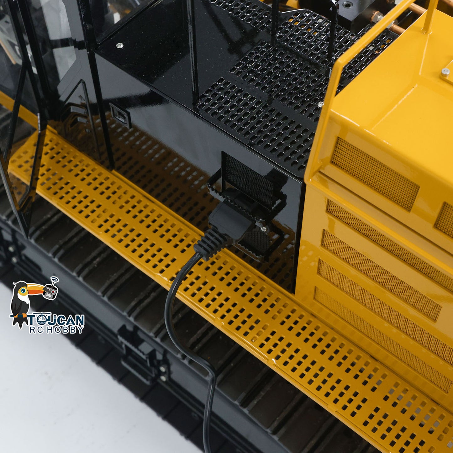 TYMX 390F 1/8 Metal Hydraulic RC Excavator protective rail detail on heavy duty cab structure